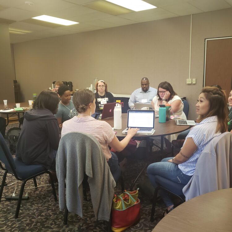 Image: & people working at a table during a training